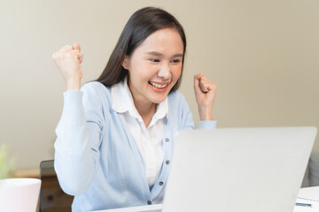 Good news reaction concept, Young adult females reading emails and have joyful expressions after receiving an offer of a job promotion from the company.