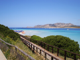 Crystal light blue waters of the sea in Stintino, Sardinia, Italy. A breathtaking coastal landscape...