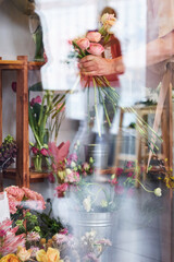 Fresh flowers seen through the window