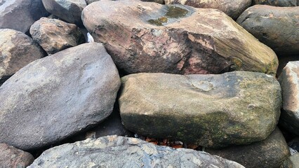 The texture of the rocks with natural cracks depicts solidity.