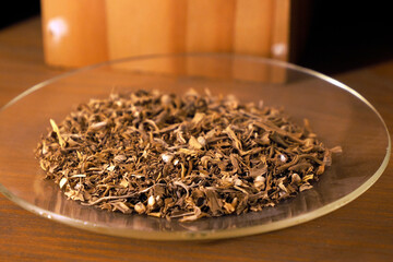 Ancient medical Cannabis leaves weed on a plate detail