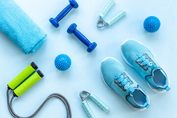 Sports equipment flat lay. Sneakers and dumbbells for fitness