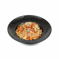 A black bowl with stir-fried noodles, chicken, bell peppers, and sesame seeds, showcasing a delicious Asian dish