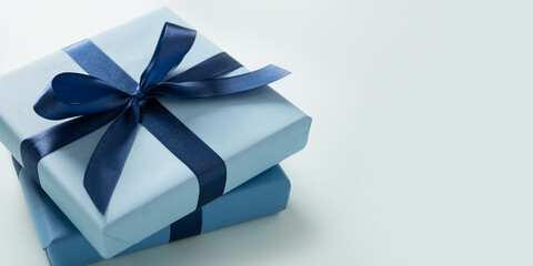 Banner with two blue gift boxes on pastel blue background. Greeting card, flyer or invitation....