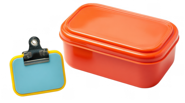 Orange lunchbox placed next to a clip badge featuring customizable light blue copy space, isolated against a transparent background for versatile design options - Powered by Adobe