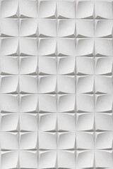 A white wall covered with three-dimensional tiles forming a geometric pattern. Textured plaster