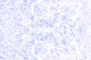 Blue water with ripples on the surface. Defocus blurred transparent blue colored clear calm water surface texture with splashes and bubbles. Water waves with shining pattern texture background.