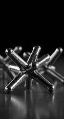 Metal Jack Game Pieces on Dark Background