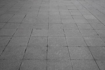 Background, tile floor. Paved stone seamless pattern. Pavement tile texture. Stone mosaic background. Cobble floor exterior pattern. Block sidewalk ornament.  illustration isolated on gray background.