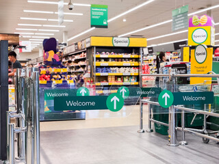 welcome signs at the entrance of of a supermarket