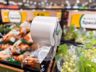 roll op plastic bags in the fresh food section of the supermarket