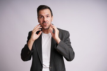 Male Model Showing Different Emotions on White Studio Background