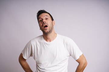Obraz premium Male Model Showing Different Emotions on White Studio Background