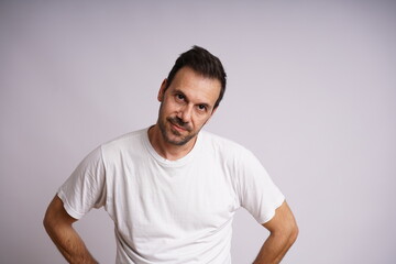 Obraz premium Male Model Showing Different Emotions on White Studio Background