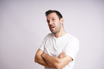 Fototapeta premium Male Model Showing Different Emotions on White Studio Background