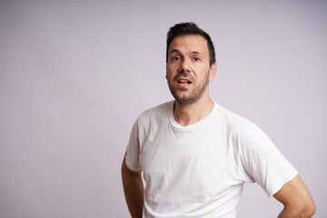 Obraz premium Male Model Showing Different Emotions on White Studio Background