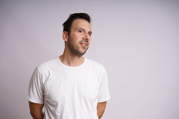 Fototapeta premium Male Model Showing Different Emotions on White Studio Background