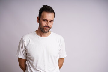 Obraz premium Male Model Showing Different Emotions on White Studio Background