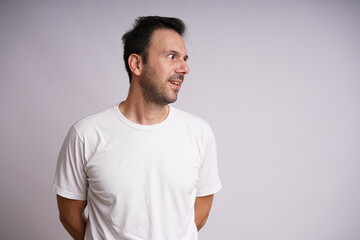 Fototapeta premium Male Model Showing Different Emotions on White Studio Background