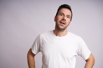 Obraz premium Male Model Showing Different Emotions on White Studio Background