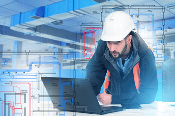 Man engineer of ventilation systems. Designing air-conditioning ducts. Engineer develops industrial utilities via laptop. Man builder studies ventilation drawings. Designing air handling unit