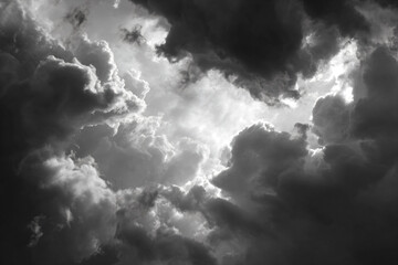 a black and white photo of a sky with clouds