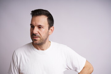 Fototapeta premium Male Model Showing Different Emotions on White Studio Background