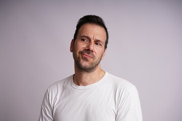 Obraz premium Male Model Showing Different Emotions on White Studio Background
