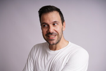 Fototapeta premium Male Model Showing Different Emotions on White Studio Background