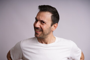 Obraz premium Male Model Showing Different Emotions on White Studio Background