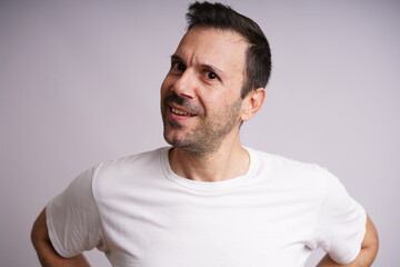 Obraz premium Male Model Showing Different Emotions on White Studio Background