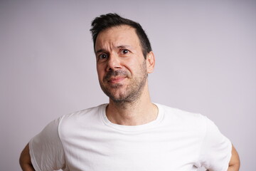 Obraz premium Male Model Showing Different Emotions on White Studio Background