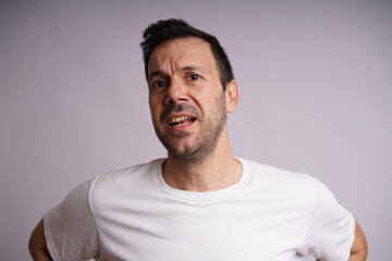 Obraz premium Male Model Showing Different Emotions on White Studio Background