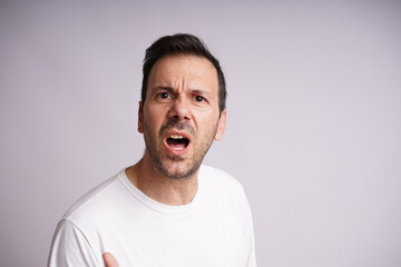 Obraz premium Male Model Showing Different Emotions on White Studio Background