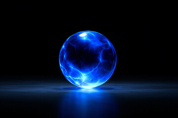 a blue glowing sphere on a black surface