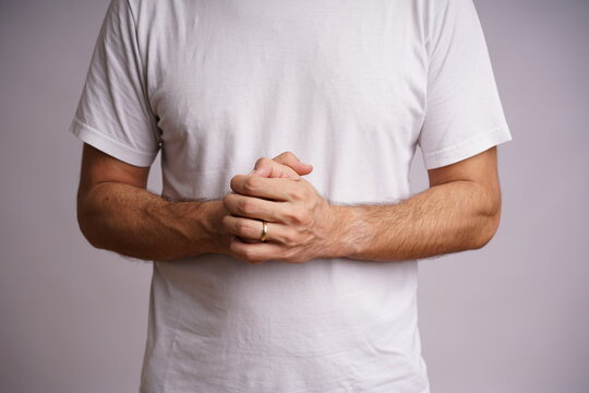 Expressive Male Hands on White Background in Studio Lighting