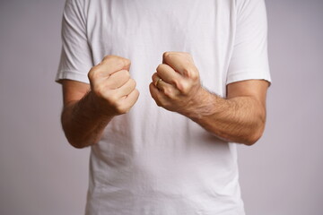 Expressive Male Hands on White Background in Studio Lighting