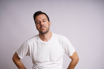 Obraz premium Male Model Showing Different Emotions on White Studio Background