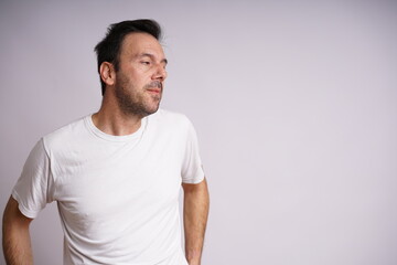 Obraz premium Male Model Showing Different Emotions on White Studio Background
