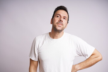 Fototapeta premium Male Model Showing Different Emotions on White Studio Background