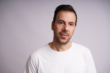 Obraz premium Male Model Showing Different Emotions on White Studio Background
