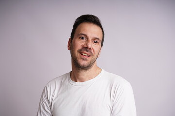 Obraz premium Male Model Showing Different Emotions on White Studio Background