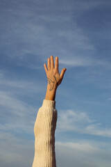 hand pointing up happiness in the sky