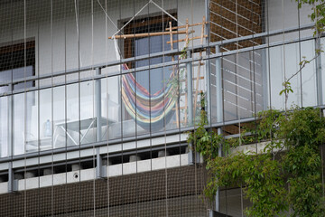 Modern Balcony with Hammock Chair and Protective Netting