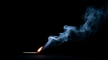 Lit matchstick with curling smoke trails against a dark background, highlighting fiery glow and delicate wisps, creating a dramatic, captivating scene with ample copy space for design