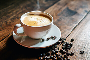 Coffee cup and coffee beans on wooden table, Espresso Crema coffee cup aromatic