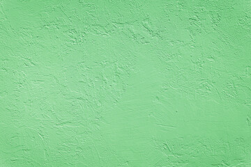 Beautiful uneven green texture. Neutral decorative background.