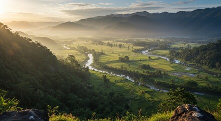 Serene valley landscape with winding river, rice paddies, and distant mountains at sunrise