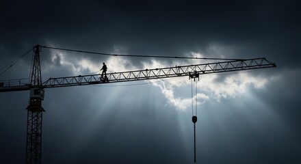 Silhouette of a Construction Worker on a Crane Against a Dramatic Sky