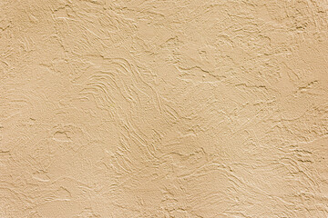 Beautiful uneven beige texture. Neutral decorative background.